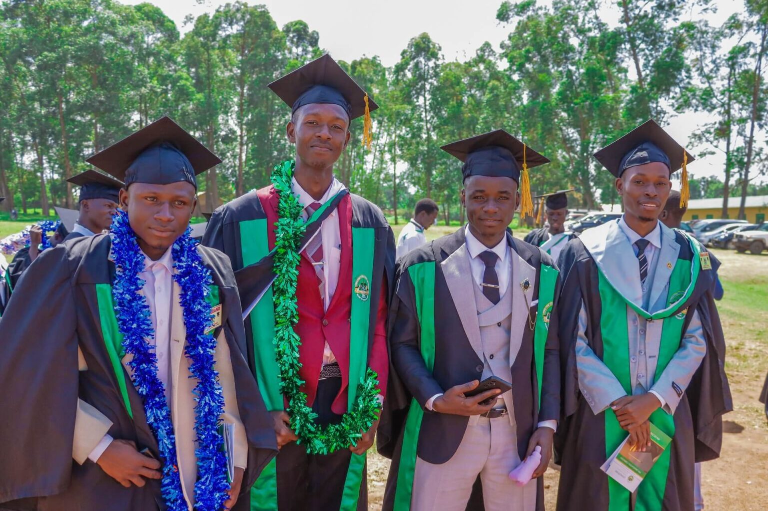 Smiling graduates from Livingstone International University celebrating their achievement