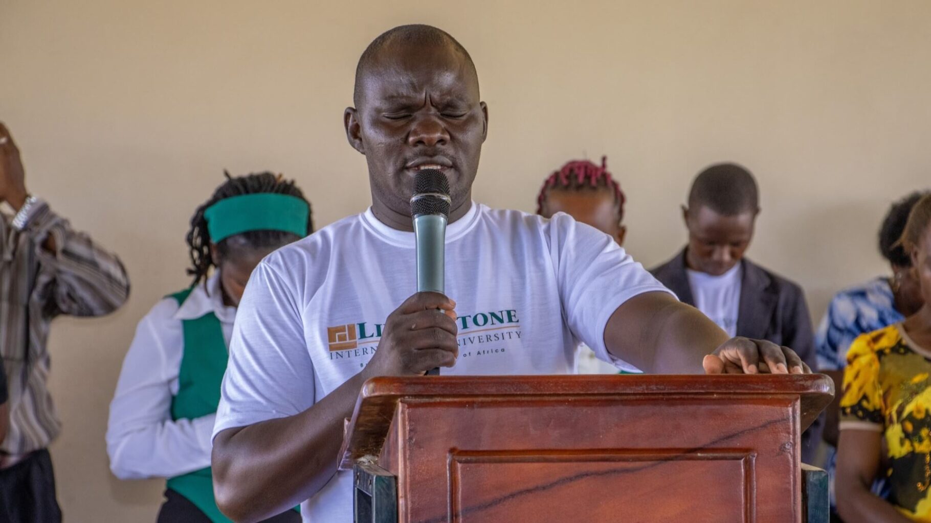 LIU Staff praying