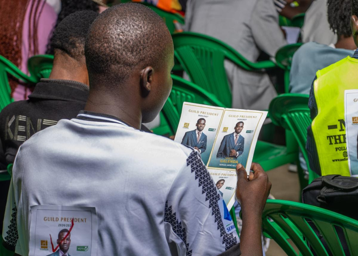 An LIU student holding a flyer